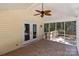 View of a screened-in porch with tile flooring, ceiling fan, and access to the backyard at 219 Proctor Dr, Salisbury, NC 28147