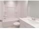 Modern bathroom featuring a clean white bathtub, toilet, and a vanity with a sink at 226 Gilead Rd, Huntersville, NC 28078