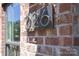 Close-up of a modern house number '226' mounted on a red brick wall next to a sleek window frame at 226 Gilead Rd, Huntersville, NC 28078