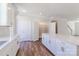 Bright kitchen features white cabinets, stainless steel hardware, an island and hard wood floors at 226 Gilead Rd, Huntersville, NC 28078