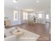 A spacious open-concept living and dining area filled with natural light and modern furnishings at 226 Gilead Rd, Huntersville, NC 28078