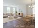 This open living room area features lots of light, hardwood floors, and nice furnishings at 226 Gilead Rd, Huntersville, NC 28078