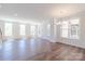 An open concept room with hardwood floors and natural light at 226 Gilead Rd, Huntersville, NC 28078