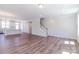 Bright living room boasts an open floor plan, hardwood floors, and staircase at 226 Gilead Rd, Huntersville, NC 28078