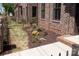 Brick townhome featuring a meticulously landscaped yard with healthy green plantings at 226 Gilead Rd, Huntersville, NC 28078