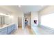 Bright bathroom with double vanity, soaking tub, and modern fixtures at 230 Mountain Island Dr # 39, Statesville, NC 28677