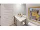 Bright powder room with grey vanity, framed mirror, and modern finishes at 230 Mountain Island Dr # 39, Statesville, NC 28677