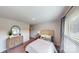 Comfortable bedroom featuring a dresser, neutral decor, and a large window for natural light at 230 Mountain Island Dr # 39, Statesville, NC 28677