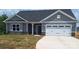 Charming single Gathering home with a two-car garage and stone accents along the base at 230 Mountain Island Dr # 39, Statesville, NC 28677