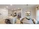 Modern kitchen boasts stainless appliances, an island with seating, and a dining area at 230 Mountain Island Dr # 39, Statesville, NC 28677