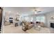 Inviting living room adjacent to kitchen with neutral decor, ceiling fan, and natural light at 230 Mountain Island Dr # 39, Statesville, NC 28677