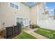 Small patio space with outdoor seating and a view of the house's siding at 2324 Bonterra Blvd, Indian Trail, NC 28079