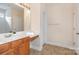 Well-lit bathroom with vanity, mirror, and tile floor at 2324 Bonterra Blvd, Indian Trail, NC 28079