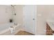 Relaxing bathroom with a soaking tub and white door at 2324 Bonterra Blvd, Indian Trail, NC 28079