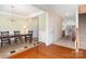 Inviting dining room with hardwood floors, chandelier, and easy access to other rooms at 2324 Bonterra Blvd, Indian Trail, NC 28079