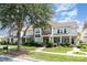 Street view of townhomes with manicured lawns, sidewalks, and inviting curb appeal at 2324 Bonterra Blvd, Indian Trail, NC 28079