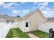 Detached garage featuring a white door, neutral siding, and fenced-in yard at 2324 Bonterra Blvd, Indian Trail, NC 28079