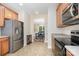 Well-equipped kitchen featuring stainless steel refrigerator and view into the dining room at 2324 Bonterra Blvd, Indian Trail, NC 28079