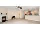 Open-concept living room with fireplace and view into the kitchen area at 2324 Bonterra Blvd, Indian Trail, NC 28079
