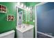 Nicely decorated bathroom featuring a white vanity and unique 'WASH' wall decor at 2426 Tory Oak Pl, Matthews, NC 28105