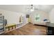 Bedroom with wood-look flooring, closet, shelving and a ceiling fan at 2426 Tory Oak Pl, Matthews, NC 28105