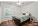 Cozy bedroom features natural light and wood-look floors at 2426 Tory Oak Pl, Matthews, NC 28105