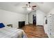 Bedroom with wood-look flooring, closet, shelving and a ceiling fan at 2426 Tory Oak Pl, Matthews, NC 28105