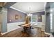 Elegant dining room featuring hardwood floors, wainscoting, and a stylish chandelier at 2426 Tory Oak Pl, Matthews, NC 28105