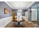 Formal dining room showcasing hardwood floors, decorative accents, and ample natural light at 2426 Tory Oak Pl, Matthews, NC 28105