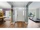 Welcoming entryway with hardwood flooring and natural light, with adjacent rooms at 2426 Tory Oak Pl, Matthews, NC 28105