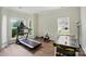 Home gym featuring workout equipment, wood floors, and bright natural light at 2426 Tory Oak Pl, Matthews, NC 28105