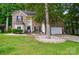 Beautiful two-story home featuring a brick facade, well-manicured lawn, and mature landscaping at 2426 Tory Oak Pl, Matthews, NC 28105
