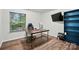 Office with wood-look flooring, and a dark wood industrial style desk at 2426 Tory Oak Pl, Matthews, NC 28105