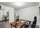Office with wood-look flooring, with desk and chair at 2426 Tory Oak Pl, Matthews, NC 28105