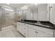 Stylish bathroom with a dual sink vanity, granite countertops, and a glass-enclosed shower at 274 Robinwood Ln, Lake Wylie, SC 29710