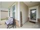 Inviting front porch with decorative welcome sign and bench seating at 274 Robinwood Ln, Lake Wylie, SC 29710