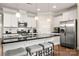 Modern kitchen featuring stainless steel appliances, an island, granite countertops, and white cabinetry at 274 Robinwood Ln, Lake Wylie, SC 29710