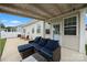 Spacious covered patio with comfortable seating and a view of the manicured backyard at 274 Robinwood Ln, Lake Wylie, SC 29710
