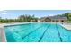 Community pool with crystal clear water and a large pool house surrounded by lounge chairs at 274 Robinwood Ln, Lake Wylie, SC 29710