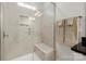 Tiled shower featuring a glass door and a built-in shower seat at 274 Robinwood Ln, Lake Wylie, SC 29710