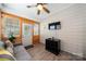 Cozy sunroom featuring plank walls, wood-look floors, neutral colors, and comfortable seating at 274 Robinwood Ln, Lake Wylie, SC 29710
