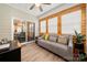 Relaxing sunroom with wood-look floors, and sliding glass doors leading to the backyard at 274 Robinwood Ln, Lake Wylie, SC 29710