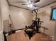Finished basement room featuring hardwood floors, a window, and a home gym workout station at 2800 Patio Ln, Gastonia, NC 28056