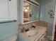 Bathroom with tiled backsplash, white vanity, sink, mirrored medicine cabinet reflecting a bedroom at 2800 Patio Ln, Gastonia, NC 28056