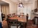 The dining room features a long wooden dining table and a stylish chandelier at 2800 Patio Ln, Gastonia, NC 28056