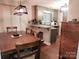 This shot shows the dining room with view of the kitchen at 2800 Patio Ln, Gastonia, NC 28056