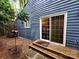 Backyard with a sliding glass door, leading to a wood deck at 2800 Patio Ln, Gastonia, NC 28056