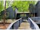 Charming home with wood siding and a connecting wooden walkway for easy access at 2800 Patio Ln, Gastonia, NC 28056