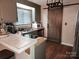 The kitchen features stainless steel appliances and a rustic barn door at 2800 Patio Ln, Gastonia, NC 28056