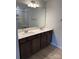 Bathroom featuring double sinks, modern fixtures, and a large mirror at 2910 Sloan Dr, Charlotte, NC 28208